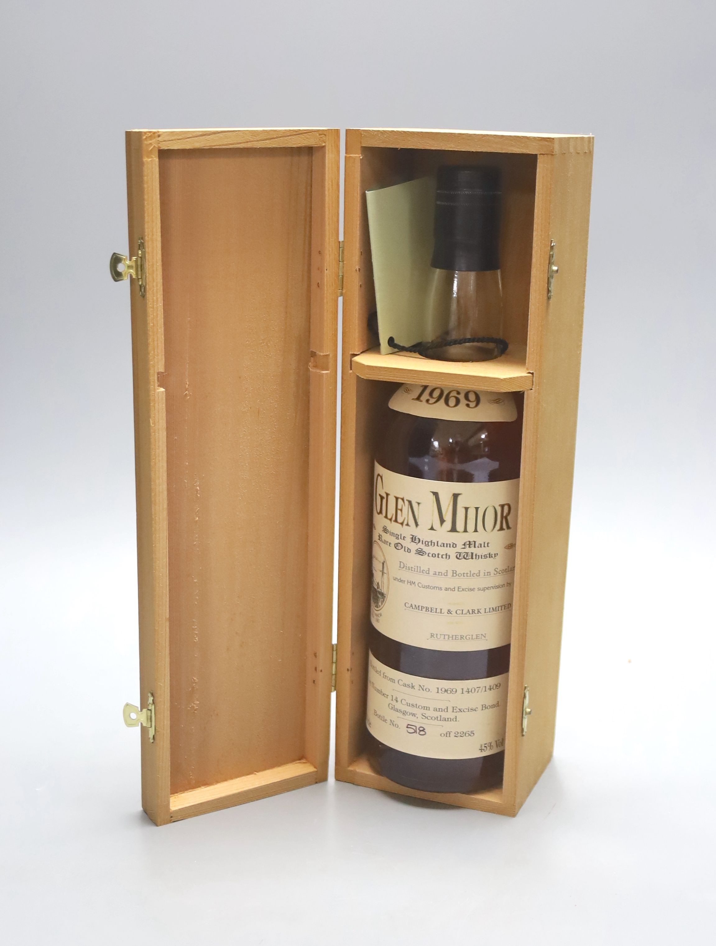 A bottle of Glen Mhor 1969 single Highland malt whisky, no. 518 off 2265, in wooden presentation case